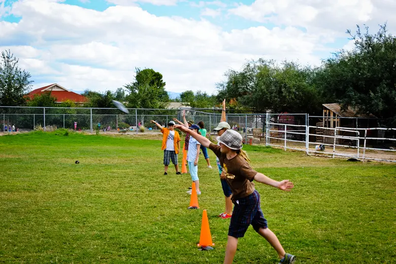 Tucson Waldorf School Photo #2 - Grade 5 students prepare for the Pentathlon in which the students meet fifth-grade classes from neighboring Waldorf schools to compete in the classic Greek athletic events of discus, javelin, wrestling, long jump and running. This celebratory event is dedicated to athleticism and individual skill and effort, the culminating event in this golden year of of human balance.
