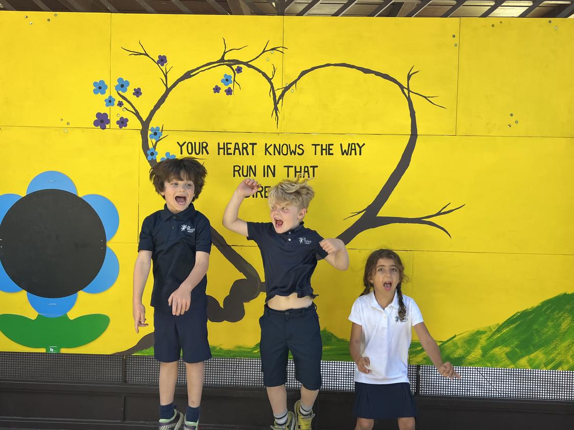 The Wesley School Photo #1 - Kindergarteners celebrate the updates to their playground in Kinderland: "Your heart knows the way, run in that direction."
