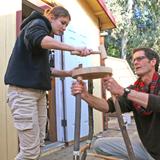 Davis Waldorf School Photo #9 - Here our woodworking teacher helps an eighth grade student in the building of a stool. Waldorf education aims to help children develop their IQ, EQ (emotional intelligence) and PQ (physical intelligence)-- integrating their intellectual and social-emotional capacities while giving them the practical experience of making things happen. Woodworking helps students exercise their ability to bring projects to fruition.
