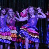 International School Of Indiana Photo #5 - A group of Grade 2 students performing at the Hispanic Heritage Celebration. This annual celebration allows ISI community members in the Spanish language track to showcase and celebrate their culture.