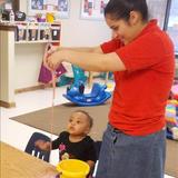 Whitcomb KinderCare Photo #6 - Ms. Rosa helps our toddlers explore their senses as they feel and smell the goop they made!