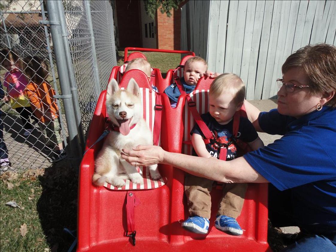 Bettendorf KinderCare Photo #1 - Infants go for a spring ride