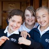 Academy Of The Sacred Heart Photo #9 - Middle School girls proud of the school logo.