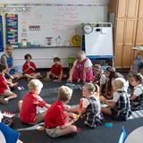 St. Bartholomew Catholic School Photo #8 - Circle time for our young learners encourages listening, talking, and sharing. Through daily, structured social interactions, we promote the development of healthy social skills.