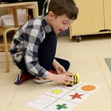 Belmont Day School Photo #4 - A student works with a Bee-Bot Programmable Robot.