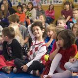 Greenfield Center School Photo #8 - Students share, problem solve and laugh a lot during the weekly All School gathering. Each week, students facilitate the All School gathering. There is often a theme, which may include opportunities to costume or participate in a school-wide game show. Classes share academic work and the school always sings together.