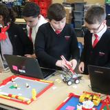 Sacred Heart STEM School Photo #2 - Scholars in grade 4 working hard on their STEM projects.