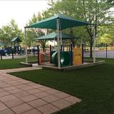KinderCare Learning Center at Cochituate Road Photo #9 - Our Infant playground is designed for babies of all ages with plenty of shade for the younger ones to lay and a small structure and sandbox for older ones to explore!