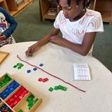 Christian Montessori School Of Ann Arbor Photo #4 - Addition with Stamp Game.