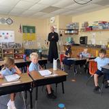 St. Stanislaus School Photo #4 - Fr. Adams visiting the Kindergarten & 1st grade classroom.