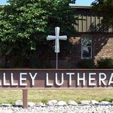 Valley Lutheran High School Photo - The brass cross, designed and made by a student, is visible from the road. The cross represents our commitment to making Christ the foundation of our ministry as we educate minds, nurture faith and cultivate leaders.