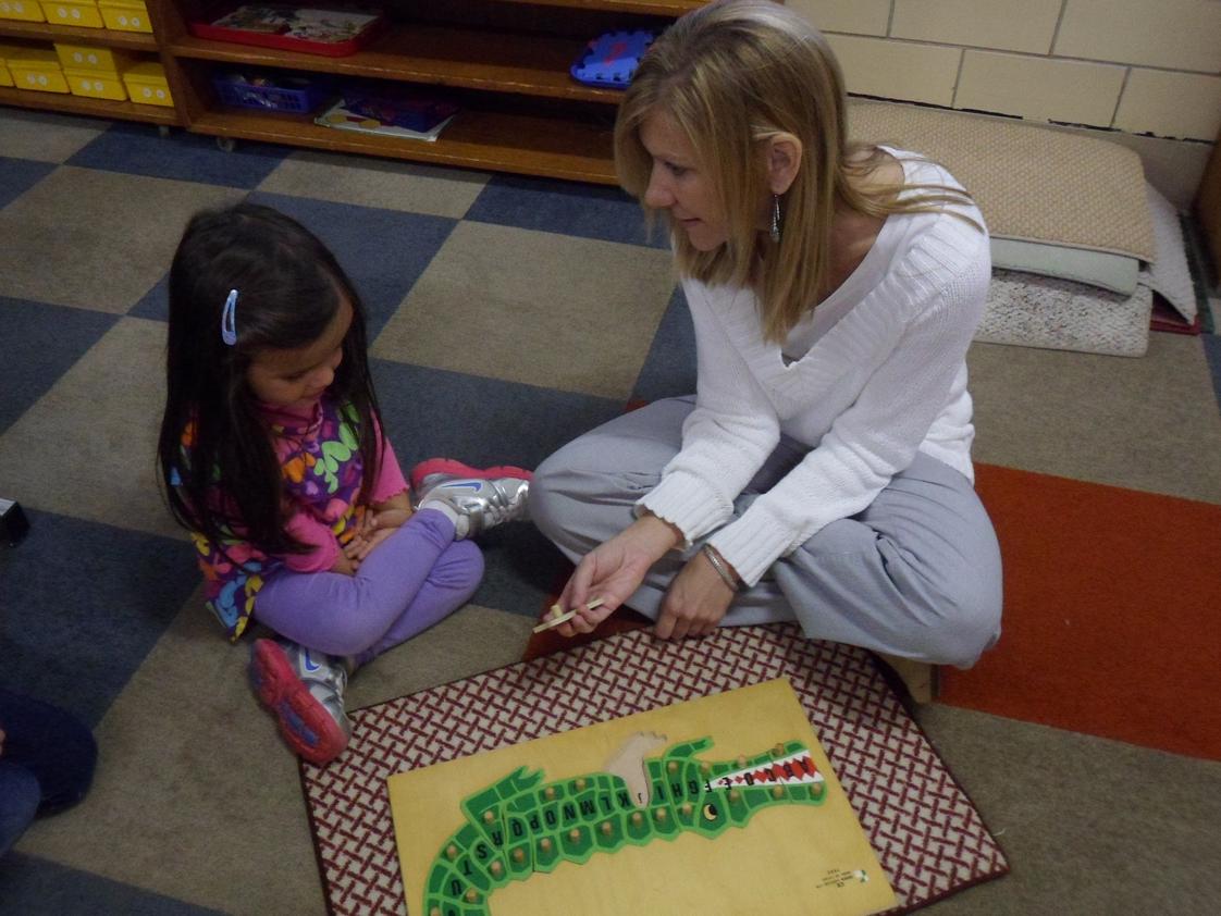 St. Joseph Catholic Academy Photo #1 - Our Montessori Preschool offers 3 and 4 year olds the opportunity, under the watchful eye of a certified Montessori Instructor, to work at their own pace toward important developmental milestones while building academic and social skills.
