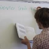Mount Ellis Academy Photo #9 - An MEA student transcribes a Greek sentence onto the whiteboard for translation.
