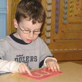 New World Montessori School Photo #2 - Sandpaper letters are used to teach phonics and proper letter formation