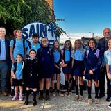 St. Rose Grammar School Photo - Group of SRGS students taking an annual First Day of School photo with Principal, Mr. Kevin Donahue and Pastor, Father Ed.