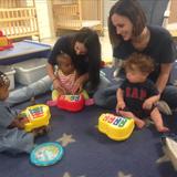 Sewell KinderCare Photo - Ms. Tracy and Ms. Kris in the infant room for music Monday