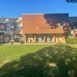 The Dillon Child Study Center Photo #1 - This is the front of the Dillon Child Study Center, plus part of our beautiful grassy area where children play once in the morning and once in the afternoon.