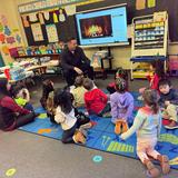 Sacred Heart School Photo #10 - Mystery Reader in Pre-K 4. Parents are invited to come in and read a story to the children in Pre-K 3, Pre-K 4, and Kindergarten. At the teacher's request, this is also done in other grades too. Here a student's Dad surprised his child's class as the Mystery Reader of the Day.