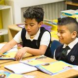 St. Ann School Photo #2 - Working in pairs during station time develops teamwork, ensures full comprehension of key objectives, and develops confidence as students have the chance to help each other learn.