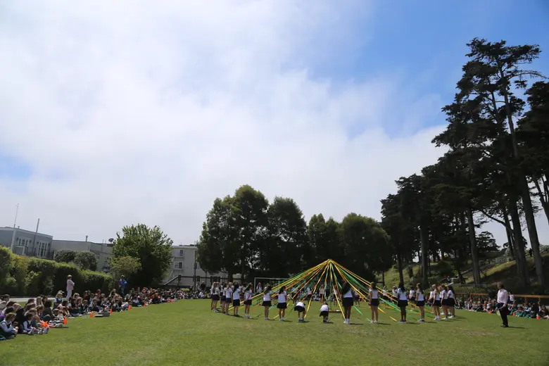 Katherine Delmar Burke School (Burke's) Photo #2 - The Maypole ceremony each spring takes advantage of our campus' beautiful open space.