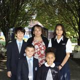 Villa Maria Academy Photo #2 - Principal Mrs. Janice Mastropietro posing with some students on the Statue of the Blessed Mother walkway.