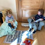 Montessori School Of Durham Photo #4 - Toddlers read together in a cozy space in the classroom.