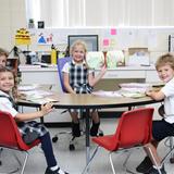 St. Thomas More Catholic School Photo #6 - First graders reading together