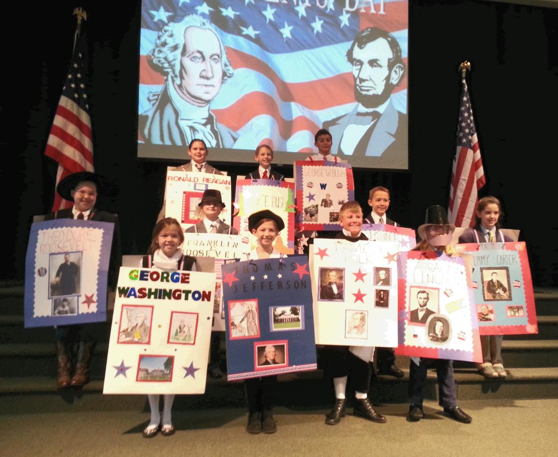 Statesville Christian School Photo - Fourth grade students participate in an annual President's Day parade.