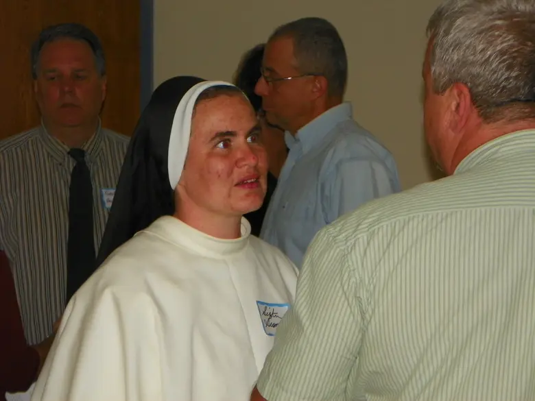 St. Gertrude School Photo #2 - Sr Gianna, O.P., discusses Junior High procedures with a parent at a "Back to School" night. The sister teaches Religion to 6th, 7th, and 8th grade students.