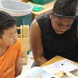 Cleveland Montessori Photo #4 - Book Buddies offer an opportunity for younger and older students to become friends and spend time together.