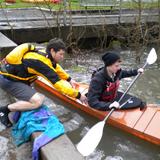 Edison High School Photo #2 - Students work with math teacher Mr. Livesey throughout the year to build two kayaks by hand; here, he helps a student with launching.