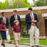 The Haverford School Photo #3 - Seniors continue the tradition of escorting kindergarten students through the Walk of Virtues to The Haverford School's opening day assembly.