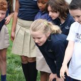 Waldron Mercy Academy Photo #6 - First grade students watch as butterflies they grew from caterpillar are released into the wild.