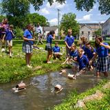 Overbrook Catholic School Photo #6 - Students in SOAR, OCS' gifted enrichment program, setting sail the ships they made in class in the brook on campus.