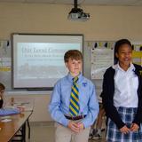 Overbrook Catholic School Photo #2 - Fifth graders presenting their debate project in English class, following a research project on local news developments.