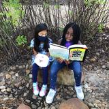 St. Francis Episcopal School Photo #5 - Lower School students reading outside together on a beautiful day!