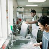 Chinquapin Preparatory School Photo #5 - Character is built in the everyday moments. Whether in the classroom or washing dishes, our students learn the value of hard work and shared responsibility.