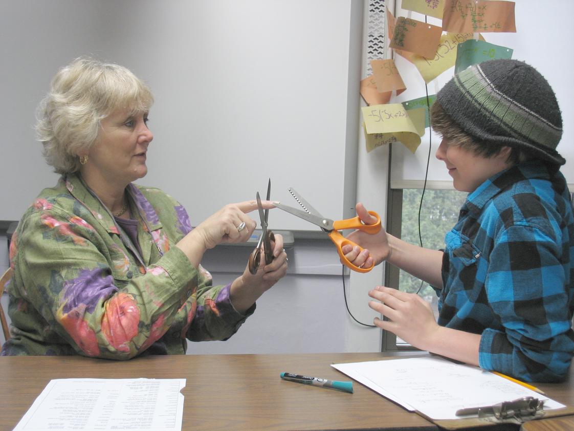 The Riverside School Photo - Our Head of School and math teacher, Dr. Laurie Boswell, considers angle measurements with a 7th grader.