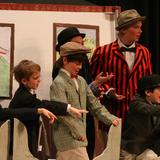 The Riverside School Photo #9 - Salesmen on the train sing the opening number of The Music Man, our all school play production in 2011, when 2nd-8th grade students worked together on rehearsals, set and prop construction, constume design, choreography, publicity, and lighting.