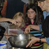 The Riverside School Photo #7 - Students work with a parent volunteer to prepare a meal for the rest of the community during our annual, all-school Fall Field Trip.