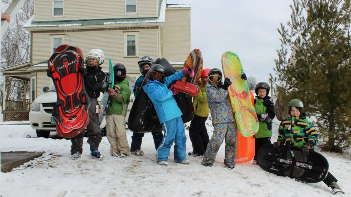 Thaddeus Stevens School Photo - Grades three and four test velocity using the snow, the hill, and their sleds.