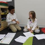 Alexandria Country Day School Photo #1 - Kindergartners confer with one another during Writing Workshop.