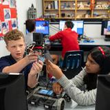 The Nysmith School Photo #2 - Future Engineers at Work! Our talented sixth graders are hard at work building their VEX Robotics robot. Their mission: to design a robot that can lift objects and place them into a container.