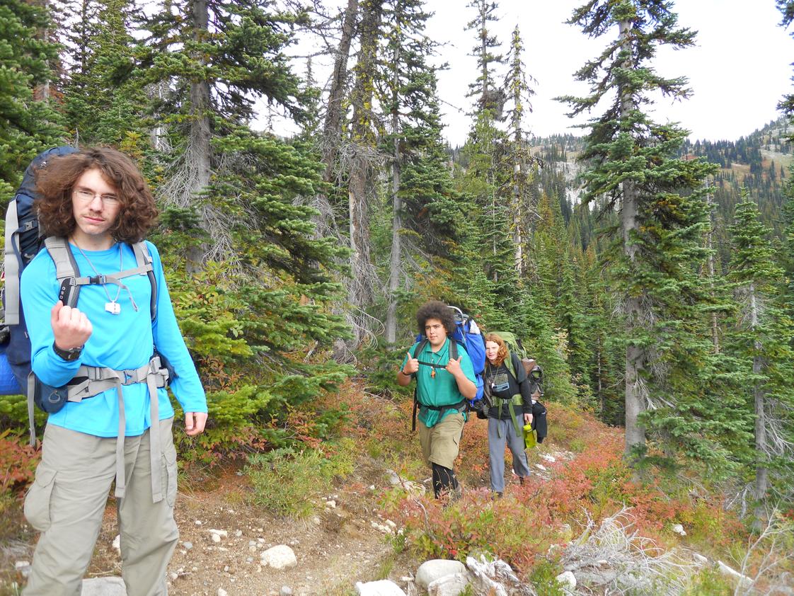 Explorations Academy Photo - Here are some of our students feeling triumphant on a multi-day backpacking trip, enjoying the beauty and bounty of our region. Explorations students develop a sense of leadership, environmental stewardship, and social responsibility both in the classroom and on the field.