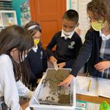St. John XXIII STEM Academy Photo #2 - First graders learning about water and landslides.