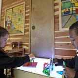 St. John XXIII STEM Academy Photo #6 - Students learn geometry skills with shapes on the light table.