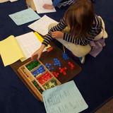 West Seattle Montessori School & Academy Photo #6 - Lower Elementary math stamp game