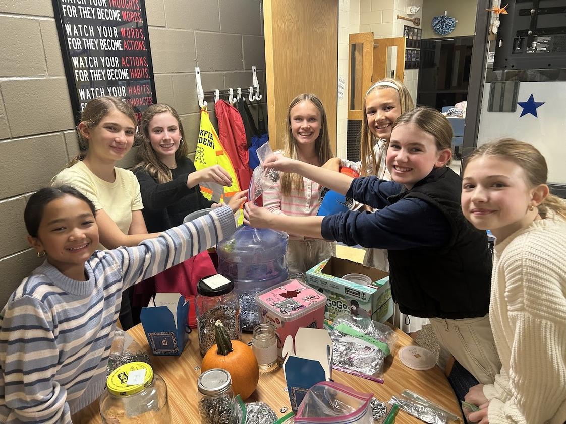 Brookfield Academy Photo #1 - Students at all levels engage in a broad range of service projects. Here, Middle School students work together to prepare soda can tabs for donation.