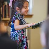Milwaukee Montessori School Photo #4 - Presenting her original poetry during the Lower Elementary tea party.