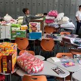 Our Lady Of Mt Carmel School Photo #8 - 8th graders sorting donations generated by the school community for local fire victims.